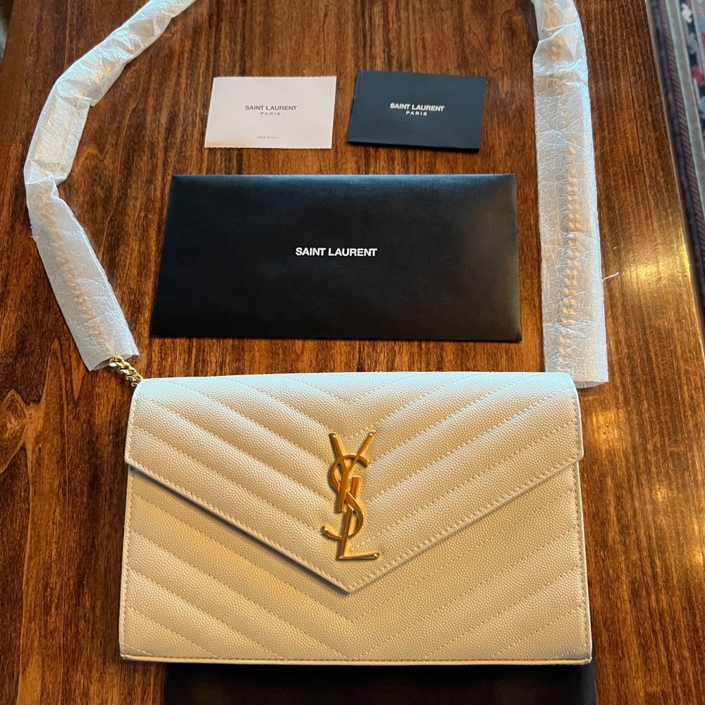CASSANDRE MATELASSÉ CHAIN WALLET IN GRAIN DE POUDRE EMBOSSED LEATHER
